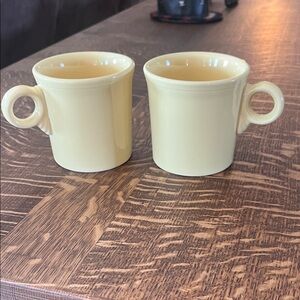 Pair of vintage Fiesta mugs light yellow